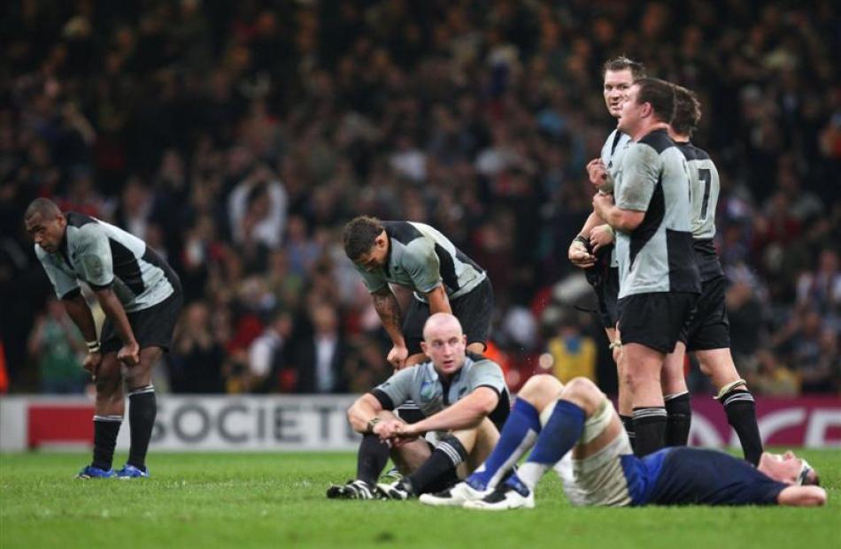 All Black players react after losing their quarterfinal to France in the 2007 Rugby World Cup....