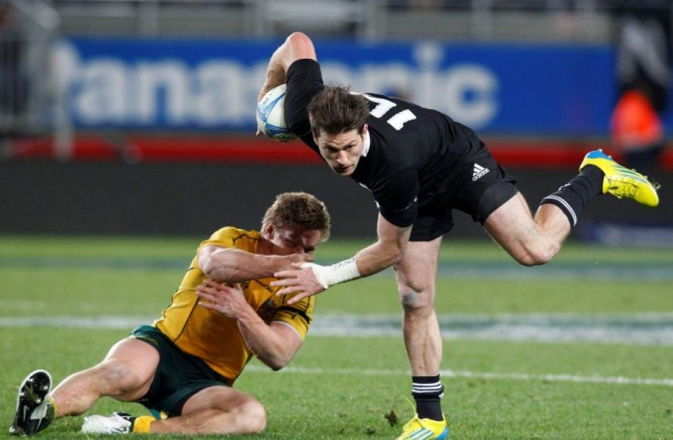 All Black winger Cory Jane gets away from Australia's Michael Hooper during their Bledisloe Cup...
