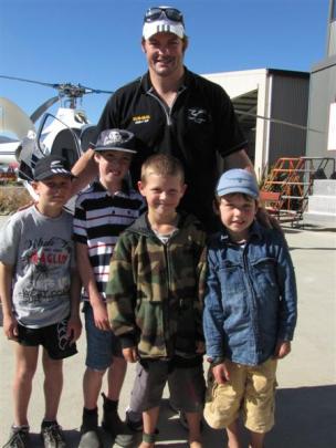 All Blacks captain Richie McCaw yesterday with (from left) Jake McClean (8) of Middlemarch,...