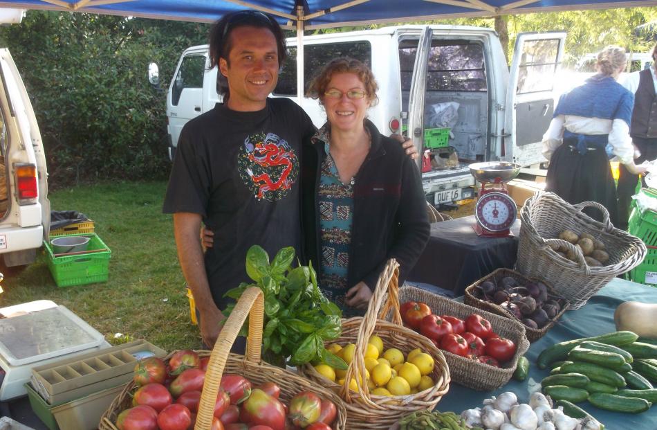 Amberley lifestylers Lorraine Liddle and Gianni Prencipe sell vegetables from their stall at the...
