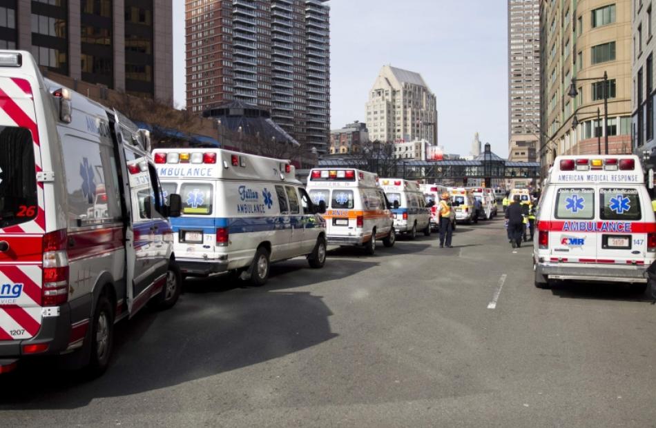 Ambulances line the street after explosions interrupted the running of the 117th Boston Marathon...