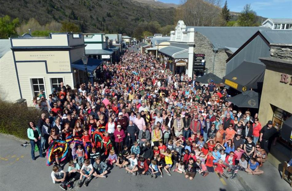 An estimated 1200 people flocked to Arrowtown's main street yesterday afternoon to be part of an...
