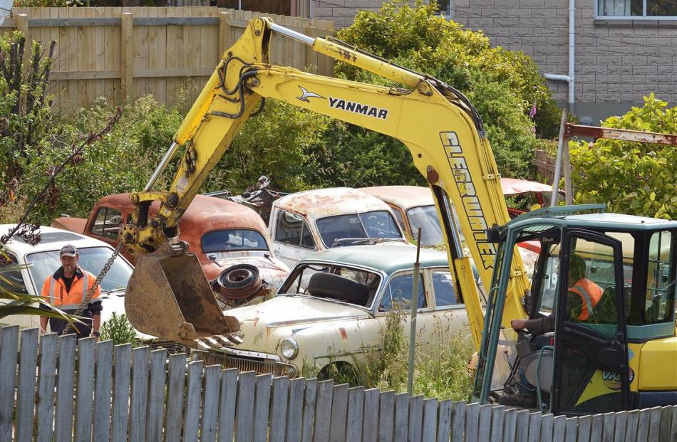 An excavator is used to drag a vehicle from a Mornington, Dunedin, property yesterday. Photo by...