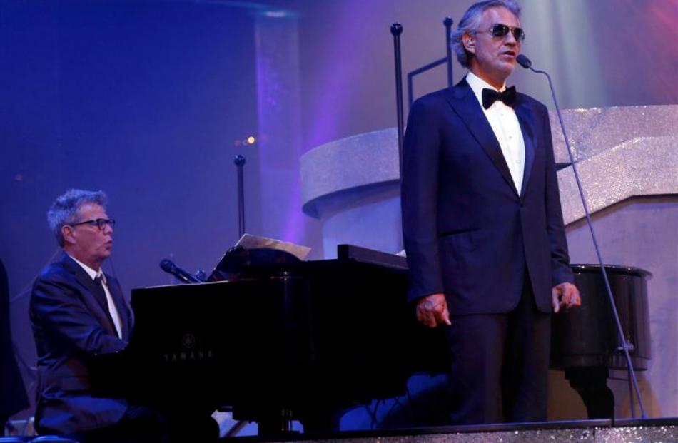 Andrea Bocelli (R) performs with David Foster at the 67th Annual Primetime Emmy Awards Governors...