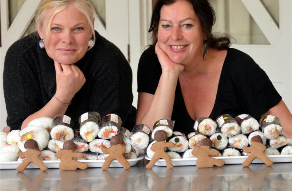 Angela Howell (left) and Nickee Blucher with their sushi and gingerbread men bound for Dunedin...