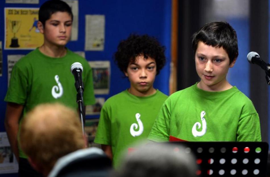 Angus Kenny (12, left), and George Conner (11, right) act as comperes for Prince Harry, as...