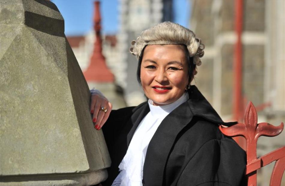 Anita Chan is all smiles after her silks ceremony in the High Court at Dunedin yesterday. Photo...