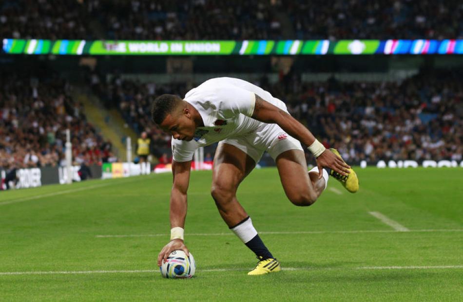 Anthony Watson scores a try in England's win over Uruguay. Photo: Reuters