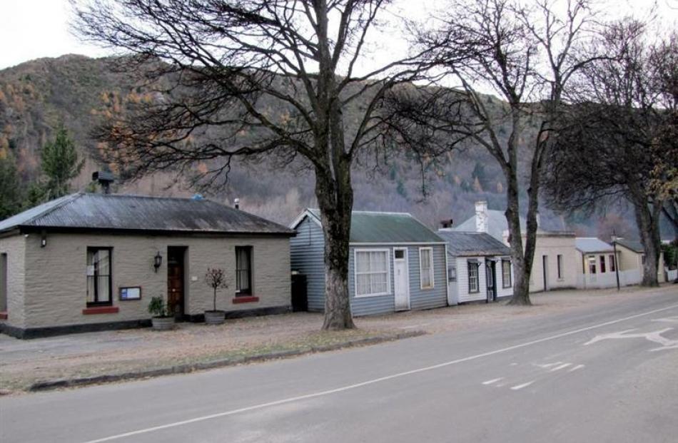 Any proposal to sell (from left) Granny Jones, Adams and Romans cottages in Arrowtown, even with...