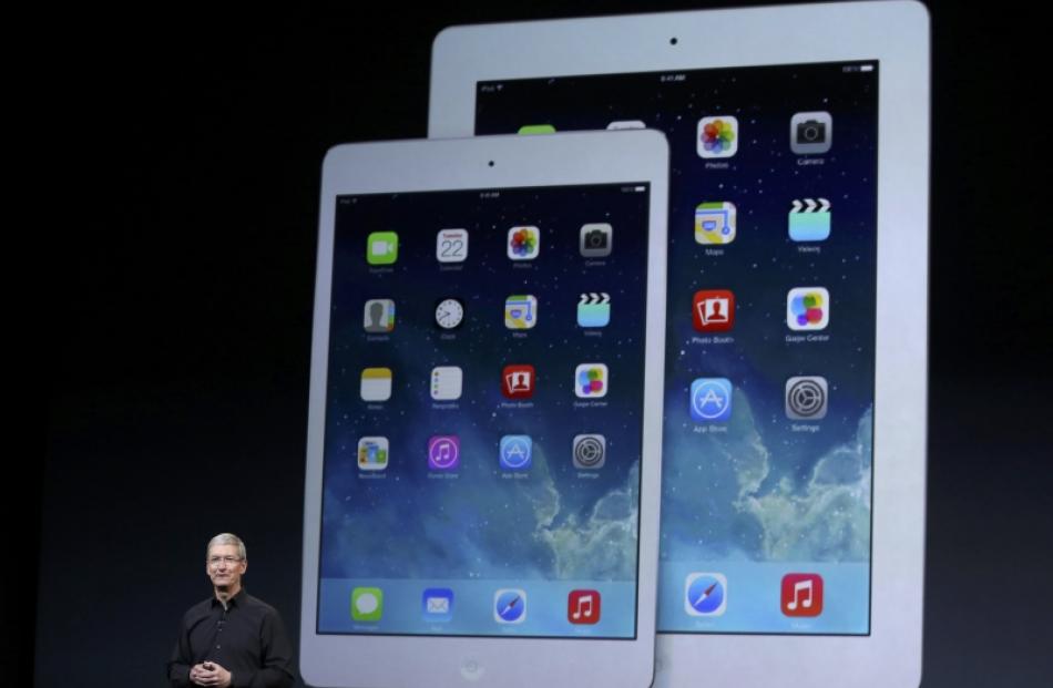Apple chief executive Tim Cook speaks on stage during an Apple event in San Francisco, California...