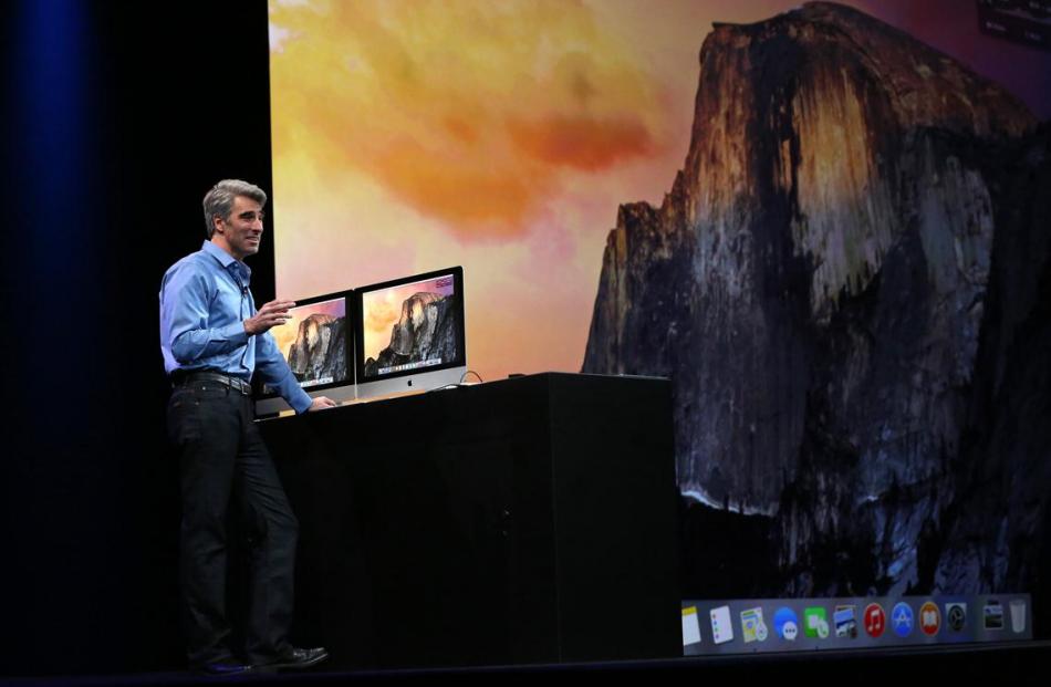 Apple vice president of software engineering Craig Federighi demonstrates the new Yosemite...