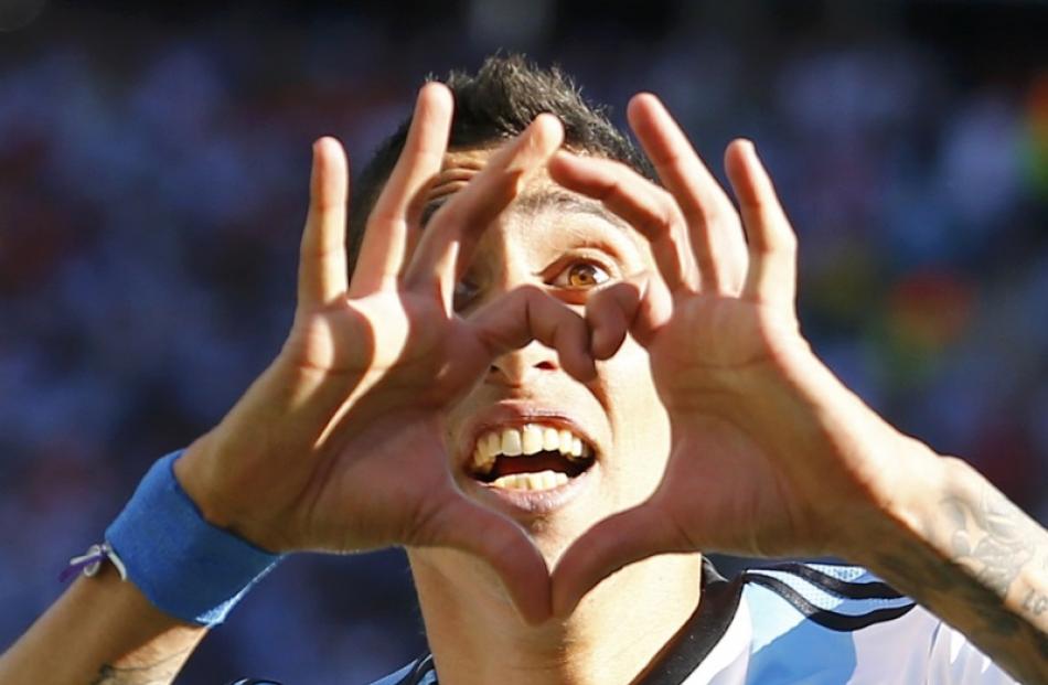 Argentina's Angel Di Maria celebrates scoring against Switzerland during extra time in their 2014...