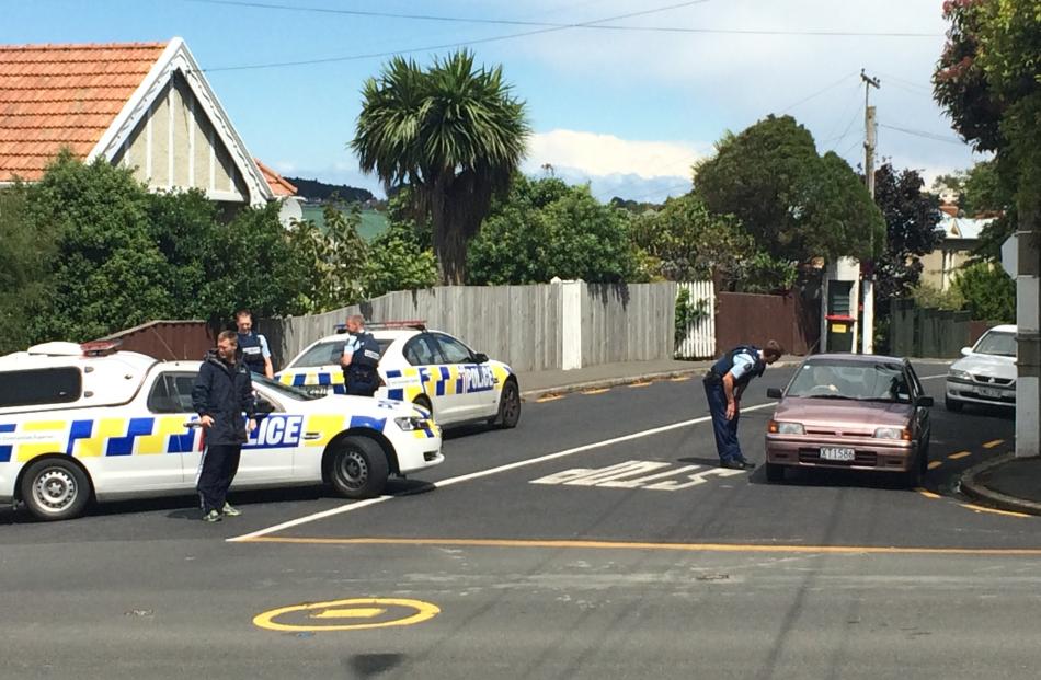 Armed police at the intersection of  Eglinton and Neidpath Roads in Mornington. Photo by Hamish...