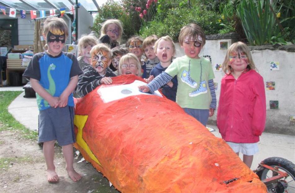 Arrowtown Community Preschool pupils attend to their 'Lightning McQueen' trolley, which will be...