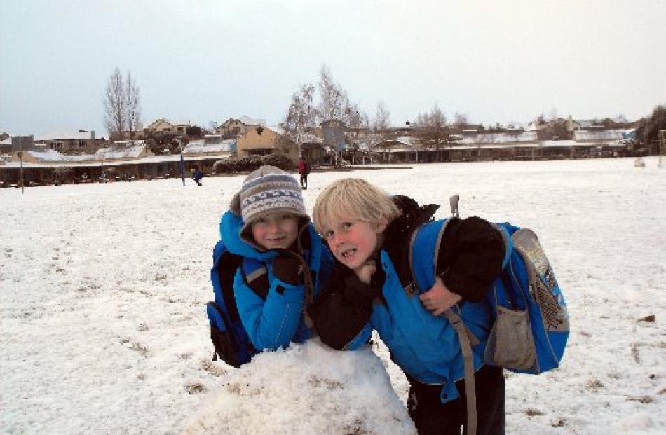 Arrowtown Primary School pupils Dominic Smith (7) and Geordie Phillips (6) play in the snow...