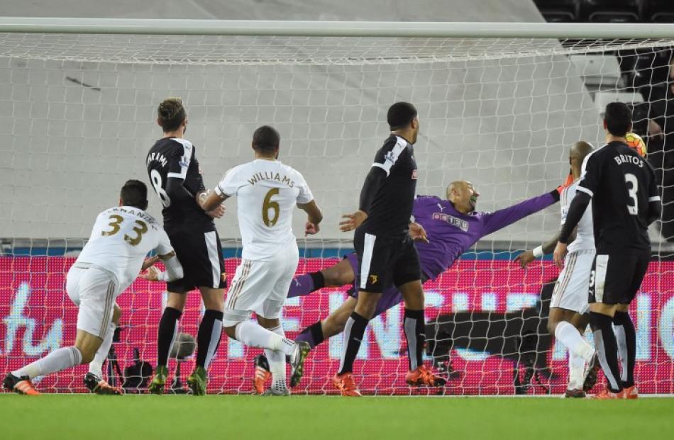 Ashley Williams scores for Swansea. Photo: Reuters