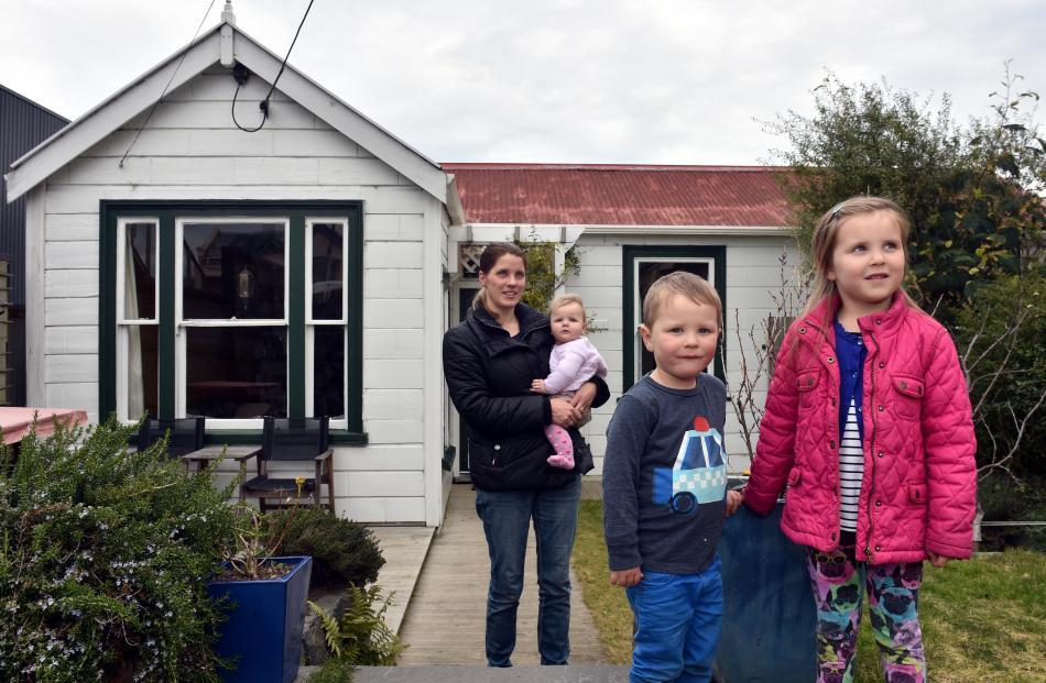 At their home in Dunedin yesterday are  Karline Doidge with her children baby Emily, Oskar and...