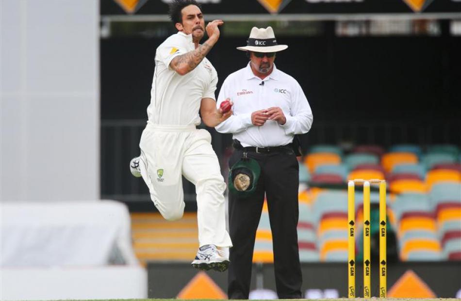 Australia fast bowler Mitchell Johnson during his delivery stride against New Zealand. Photo:...