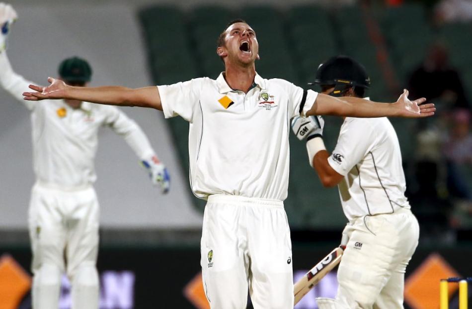 Australia's Josh Hazlewood celebrates dismissing New Zealand's Ross Taylor (right) during the...
