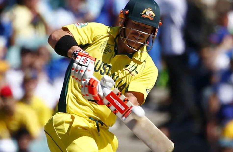 Australian batsman David Warner plays the ball for six run during his Cricket World Cup semi...