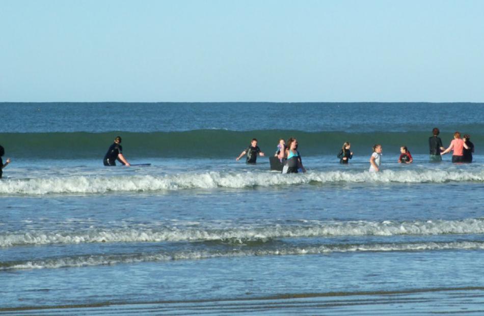 Some of 40 brave souls who took part in the annual midwinter swim at Kaka Point yesterday.