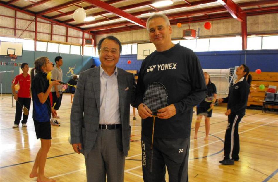 Badminton World Federation development manager Ian Wright stands with president Dr Kaang Young...