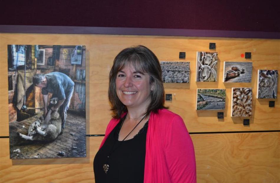 Balclutha photographer Joanne McLeary with some her photos exhibited in the community gallery at...