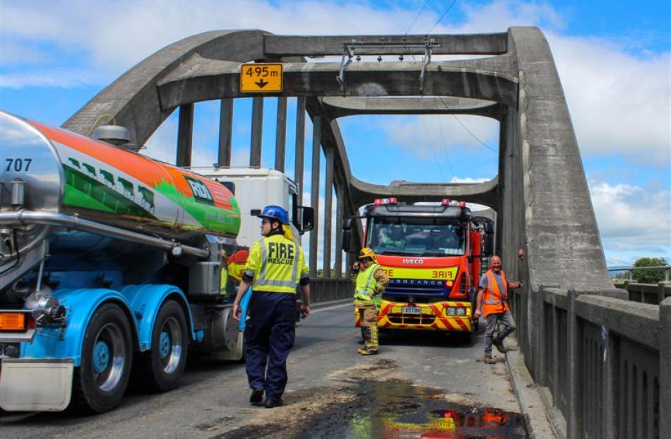 Balclutha Volunteer Fire Brigade personnel had to control traffic after a tractor hit the side of...