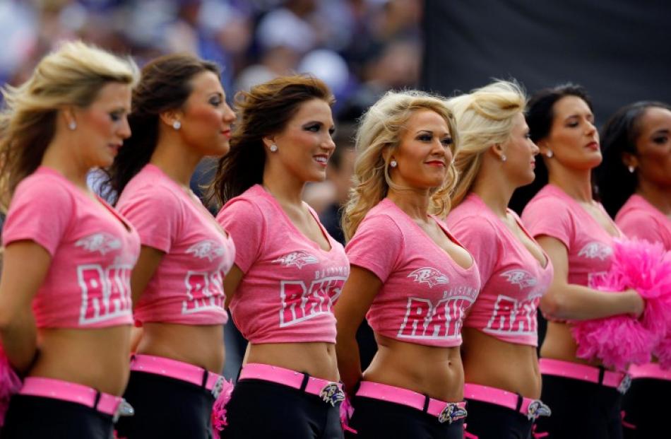 Baltimore Ravens cheerleaders are seen in their pink breast cancer awareness shirts before the...