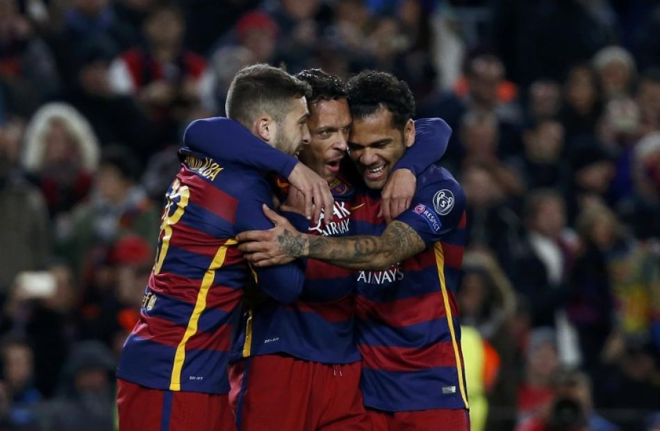 Barcelona's Adriano celebrates scoring the sixth goal with Dani Alves and Jordi Alba. Photo: Reuters