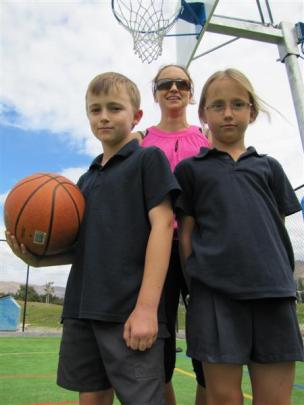 Basketballers Romili (10) and Niamh (8) Townsend and their mother Hayley Kyle  favour new indoor...