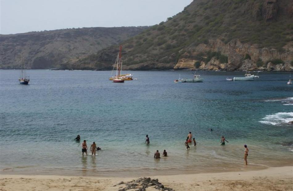 Bathers enjoy the  beach at Tarrafal.