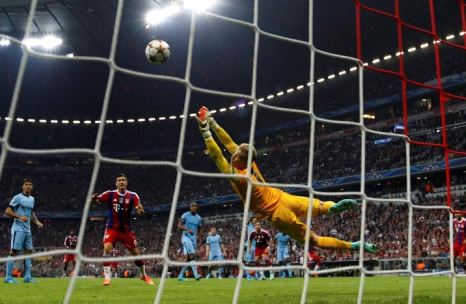 Bayern Munich's Jerome Boateng (not pictured) scores a goal past Manchester City goalkeeper Joe...