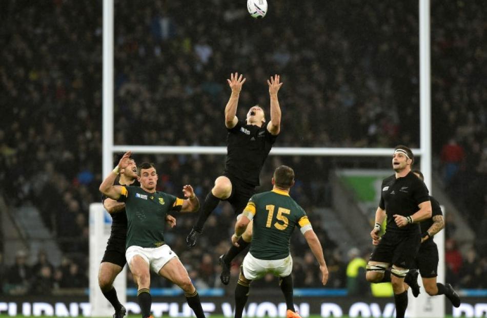 Ben Smith jumps to take a high ball for the All Blacks against the Springboks during their...