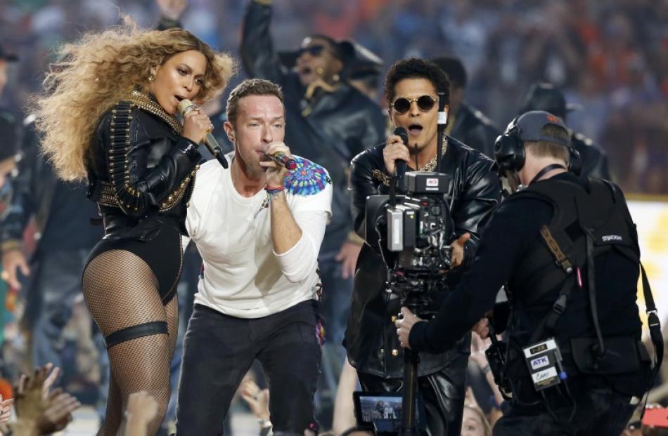 Beyonce, Coldplay's Chris Martin and Bruno Mars perform at the Super Bowl halftime show. Photo:...