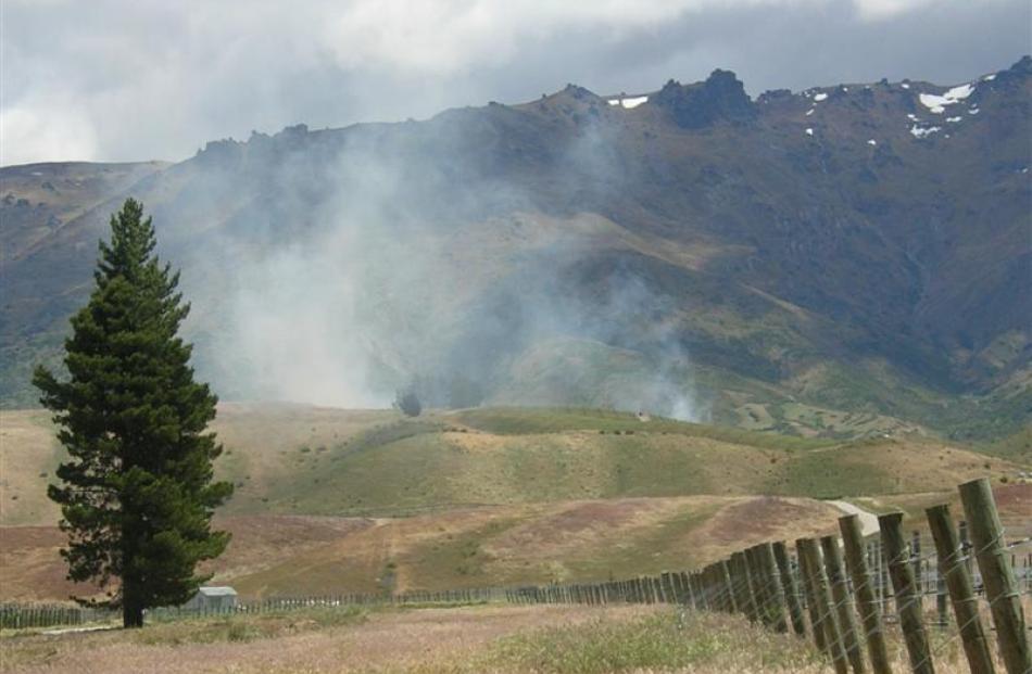 Billowing smoke from a scrub fire north of Cromwell can be seen off State Highway 6 yesterday,...