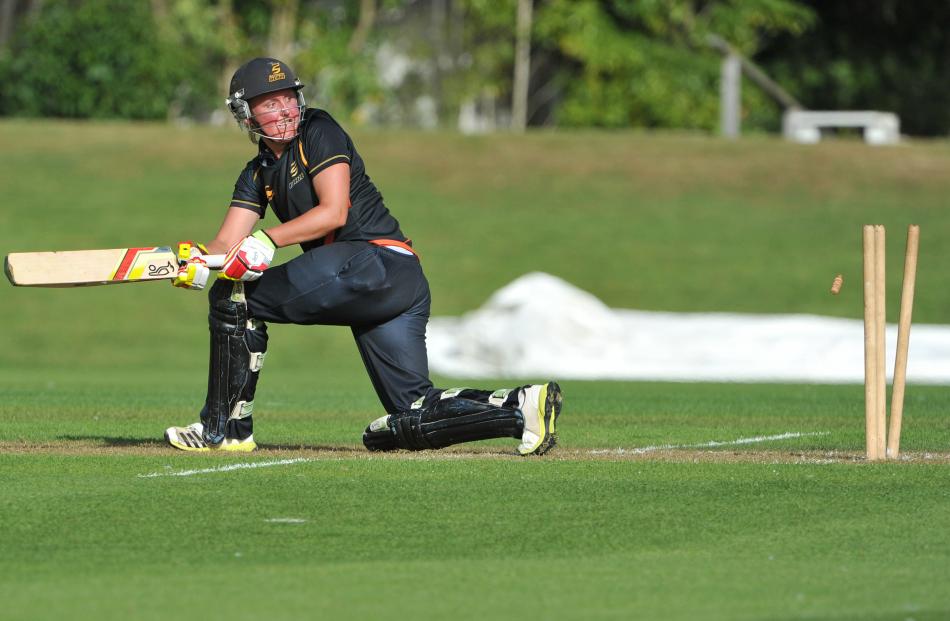 Blaze batsman Liz Perry is bowled by by Sparks medium pacer Suzie Bates during the final over of...