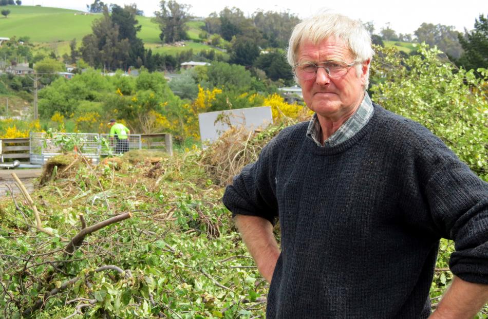 Bob Gillanders waits for another trailer-load of green waste to arrive at his site in Burnside....