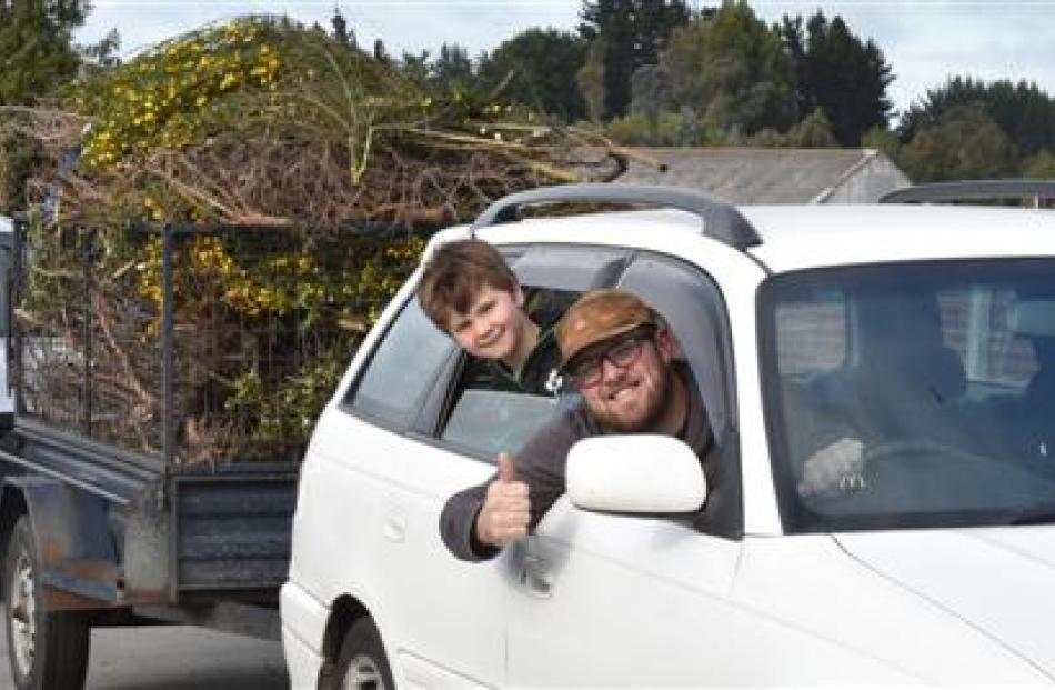 Bob Gillespie and his stepson Liam Dick (6) take advantage of a Dunedin City Council promotion to...