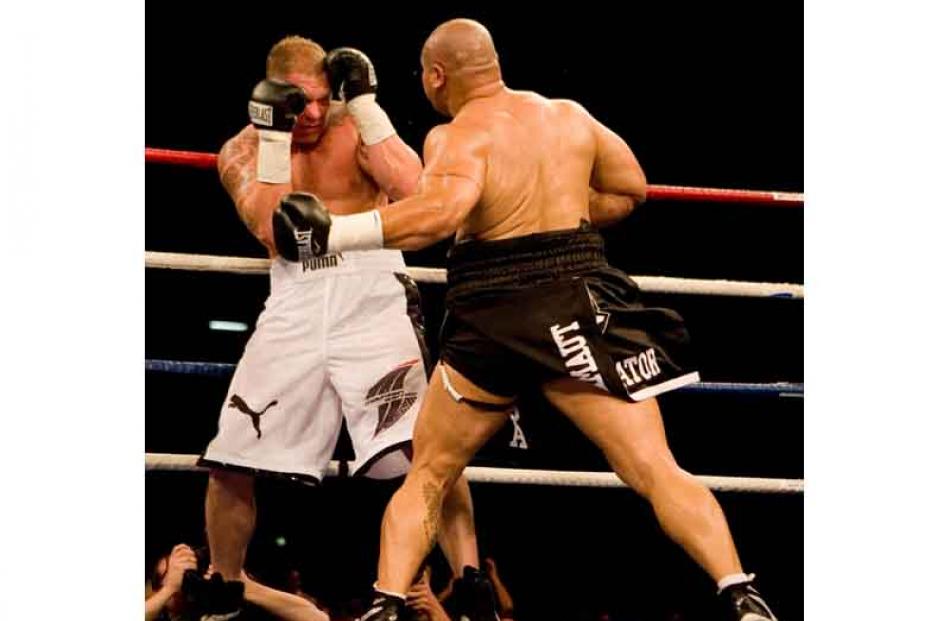 Boxer Shane Cameron is hit by David Tua during their heavyweight fight titled the Fight of the...