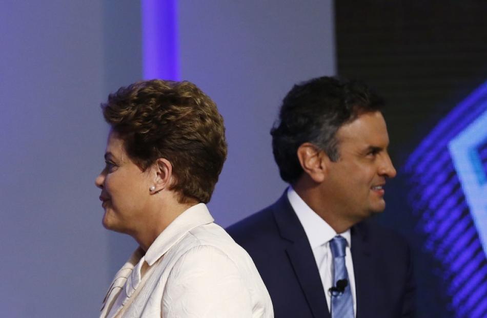 Brazil's presidential candidates Aecio Neves (R) of Brazilian Social Democratic Party (PSDB) and...