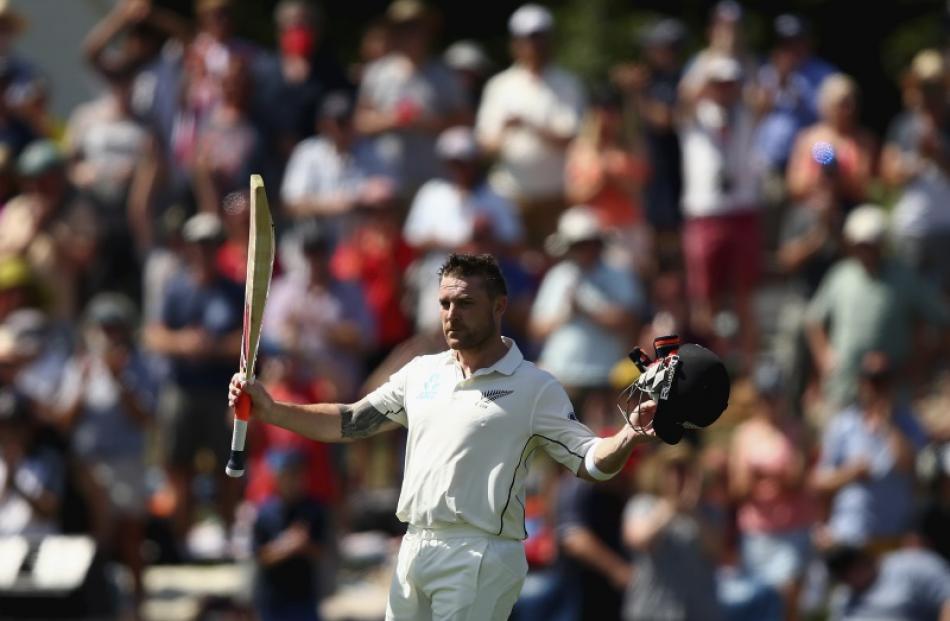 Brendon McCullum raises his bat after scoring a century in his last test. Photo: Getty Images