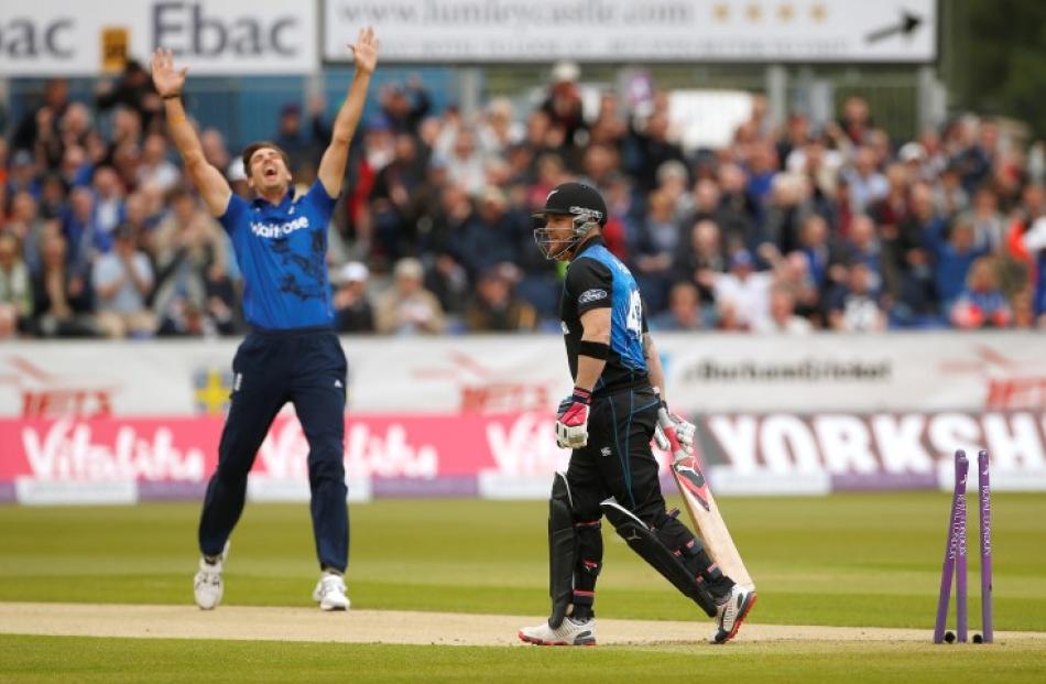 Brendon McCullum walks off after being dismissed by England's Steve Finn in the fifth one-day...