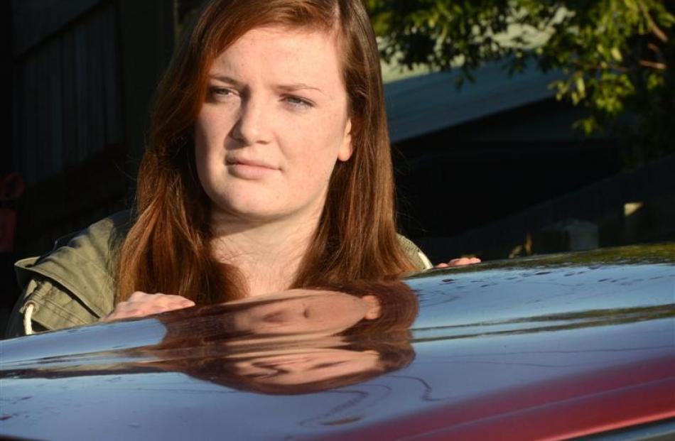 Brenna Anderson wants the person responsible to pay to have the dented roof of her car fixed.