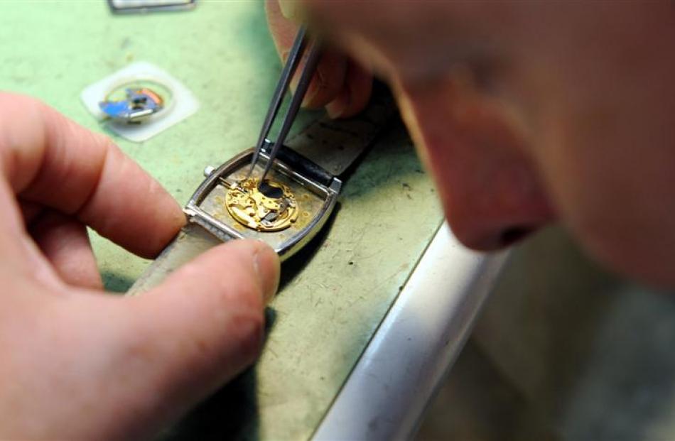 Brent Weatherall works on a watch. Photo by Craig Baxter.