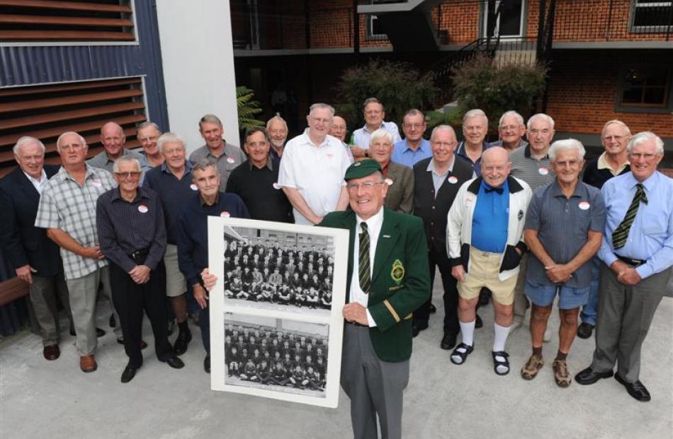 Brian Robertson, of Mosgiel, wears his school cap and hat and  holds the Christian Brothers class...