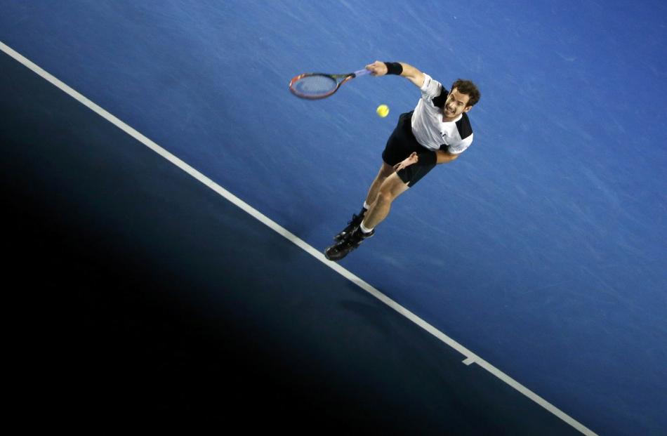 Britain's Andy Murray serves during his semi-final match against Canada's Milos Raonic at the...