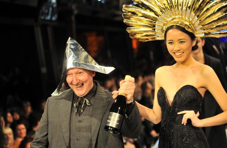 British milliner Stephen Jones wears a hat made from an Otago Daily Times and foil as he...