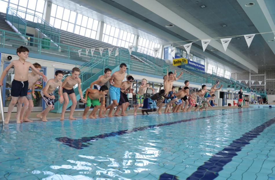 Choirboys take to the pool en masse.