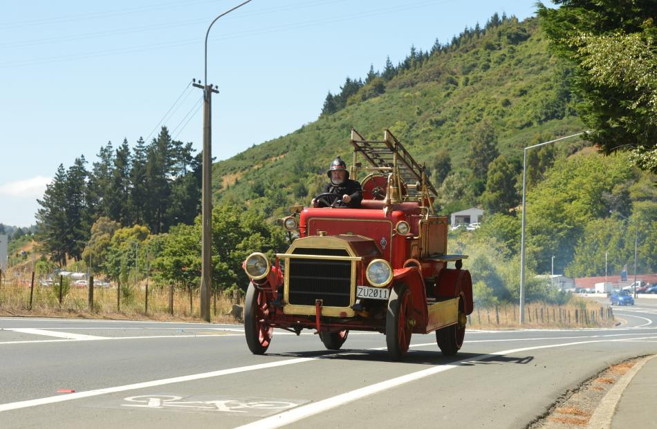 Dunedin Fire Brigade Restoration Society treasurer Tom Churchill tests a sometimes smoky  1916...